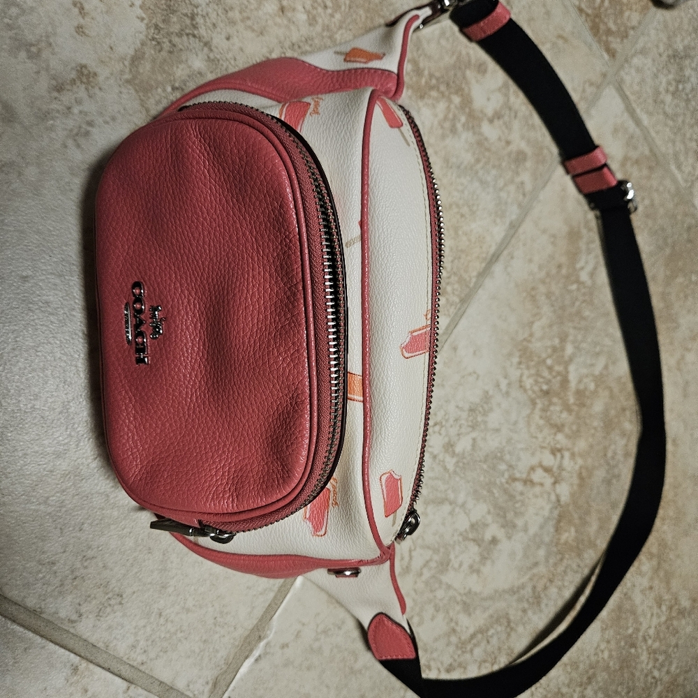 Coach waist or cross body bag with fun popsicle design. Pink and white